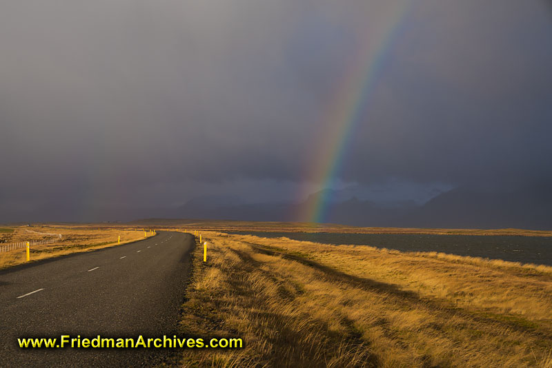 scenic,rainbow,sky,field,grass,cloudy,grey,road,